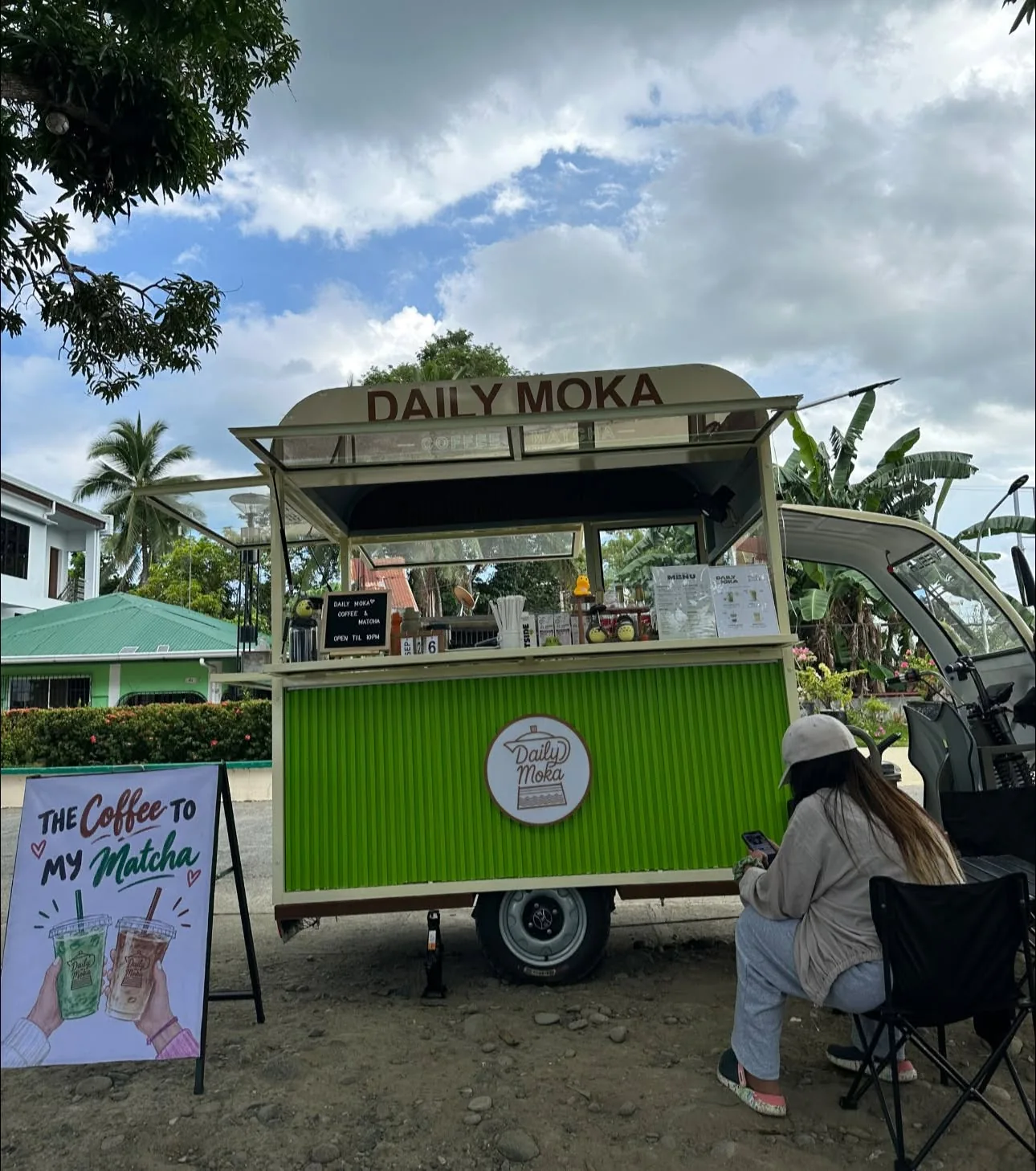 The cream and green Daily Moka coffee cart at Plaza de Bansud