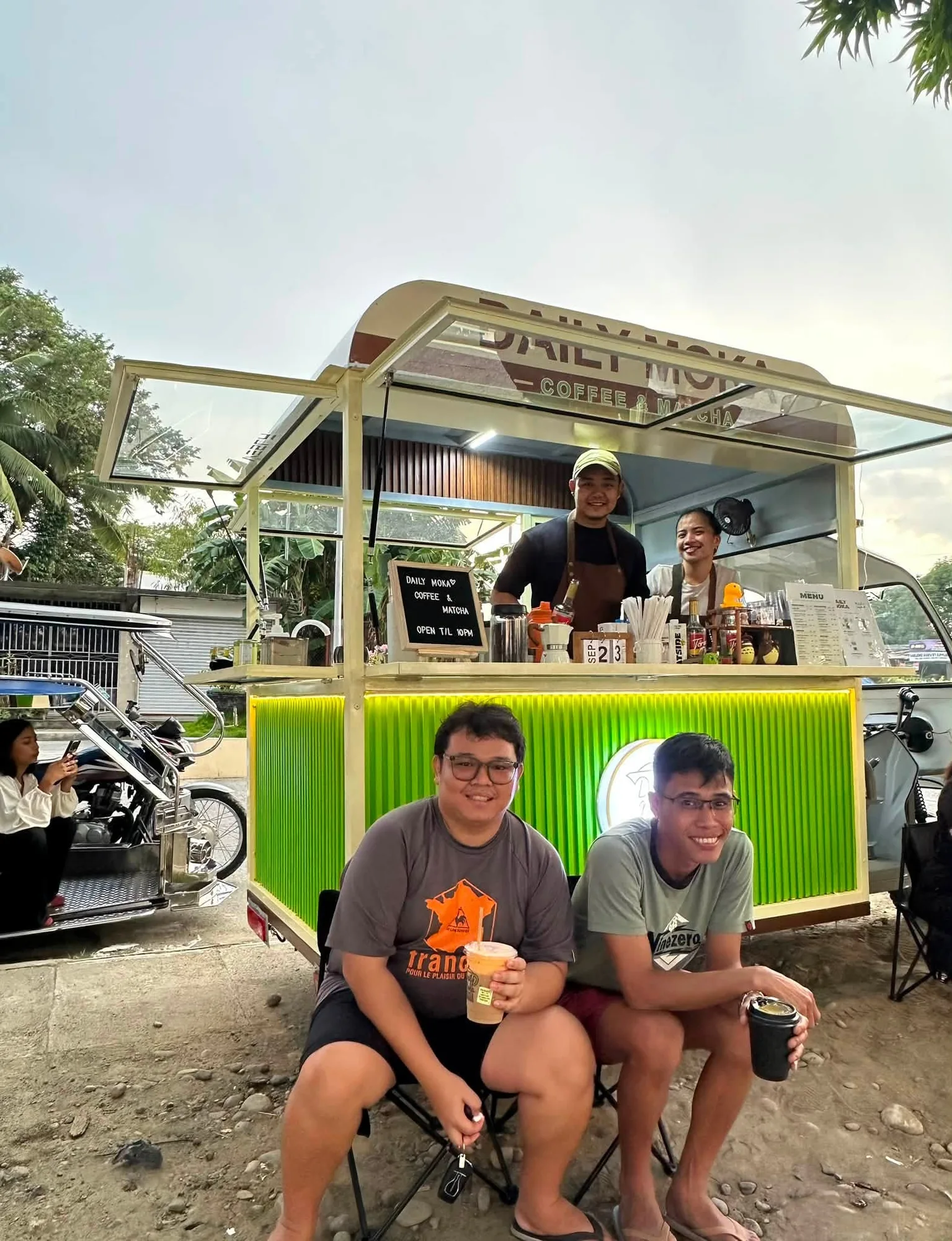 Guests enjoying drinks beside the Daily Moka coffee cart